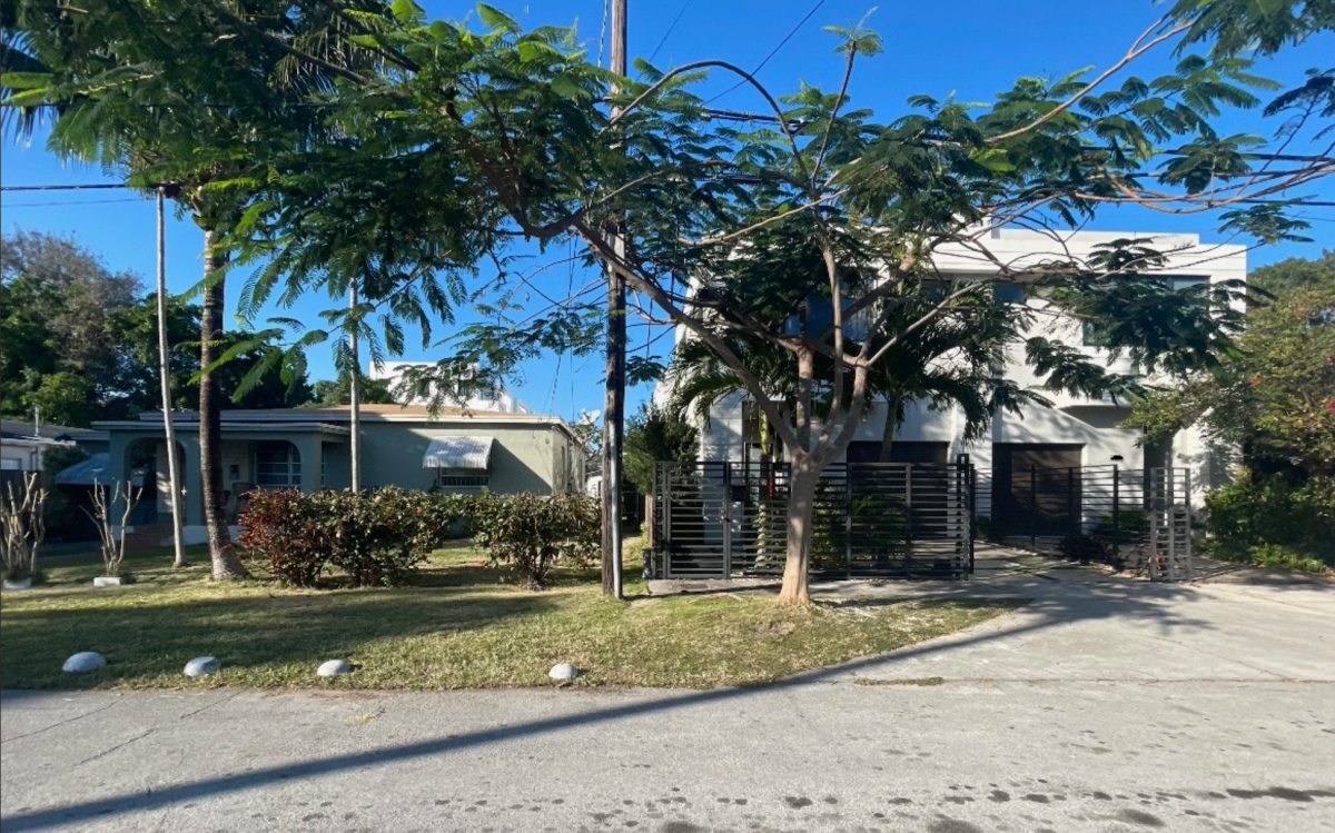 Residents have noticed a juxtaposition in their neighborhood of West Grove. A clear display of gentrification, traditional Bahamian houses and their next-door "Sugar Cube" townhouses.